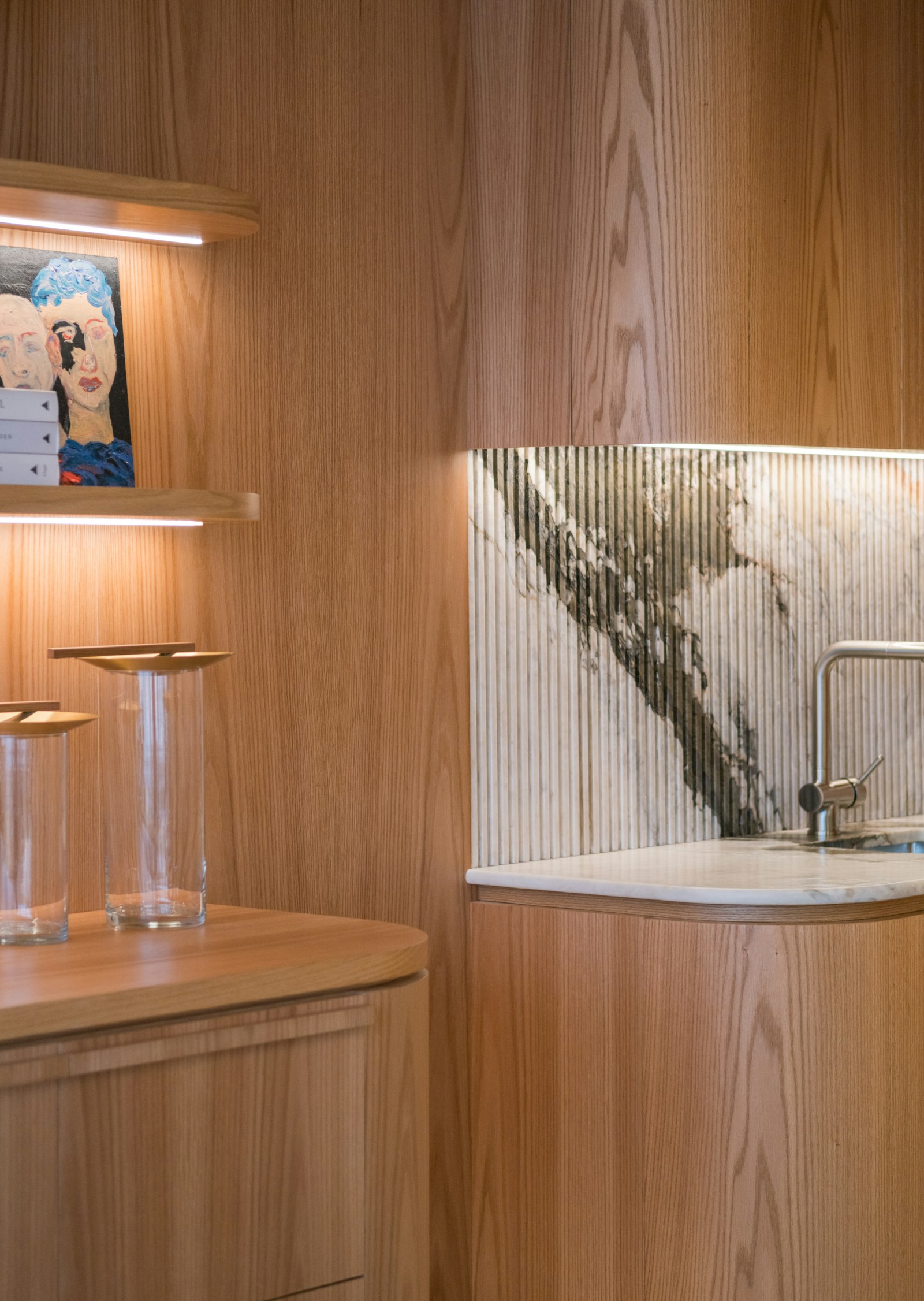 The Butler's Pantry, panelled in oak, with stemware and a marble basin.