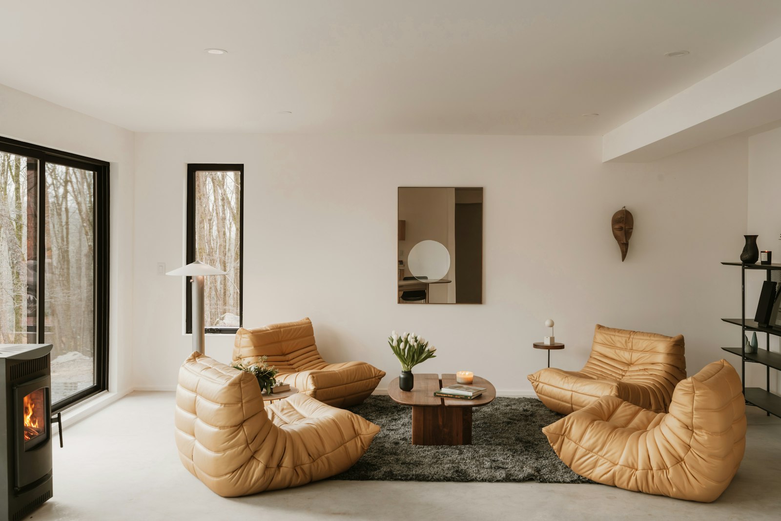 The Drawing Room, with leather seating and a working hearth.